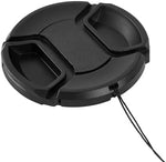Close-up of the center pinch mechanism on a 52mm replacement lens cap for DSLR cameras