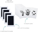 Inkless baby handprint kit being placed on white impression card.