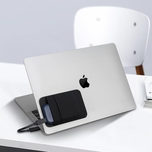 Lacdo portable storage sleeve organizing a charging cable and solid state drive on a tablet backend