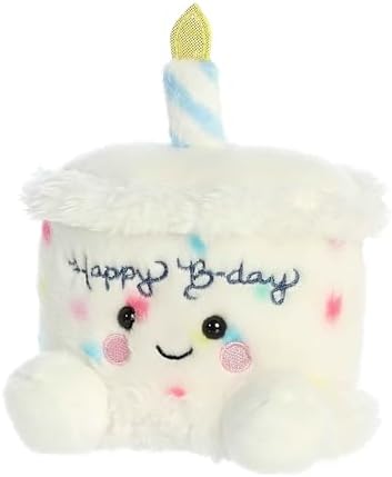 Aurora Palm Pals Happy Birthday Cake stuffed toy displayed as a bedroom decoration.
