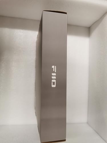 FiiO black desktop DAC and headphone amplifier showing status indicators and input selection switch controls