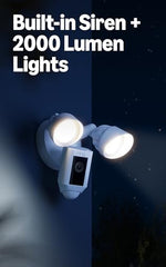 Close-up of the white Ring floodlight camera highlighting the high-definition lens and weather-resistant body.
