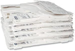Scott flushable paper toilet seat covers pack being placed inside a wall-mounted commercial washroom dispenser.