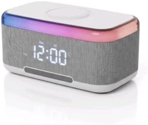Side angle of the multifunctional Bluetooth speaker showing a smartphone resting on the top wireless charging pad