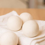 Handmade organic wool balls reducing laundry static cling and fabric wrinkles