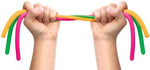 Close up of the non toxic hypoallergenic rubber material of the colorful Schylling stretch toys.