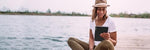 PocketBook InkPad 4 in a lifestyle setting for reading