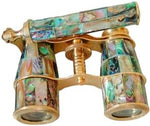 Close-up detail of the natural mother of pearl resin work on the shiny brass binocular barrels