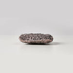 Close up of Brillo steel wool texture with built-in red soap