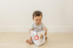 Genius Baby Toys My First Family Album showcasing its flexible design with no hard edges.