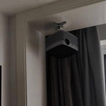 Compact 2.36 inch projector bracket mounted on a wall