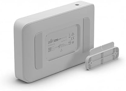 Ubiquiti USW-Lite-8-PoE mounted on a wall using the included custom wall mounting bracket kit.