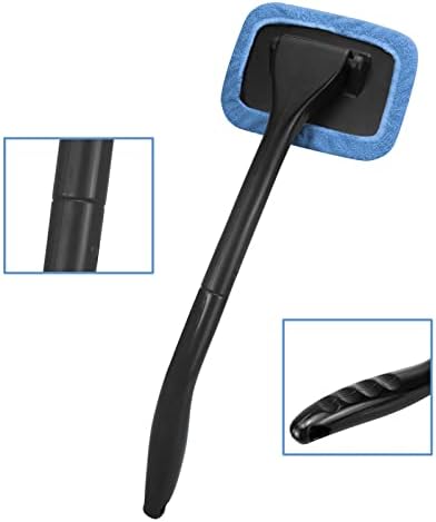 Ergonomic glass cleaning tool being extended to reach the deep lower corner of a front vehicle windshield