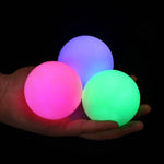 POITOI glowing rechargeable juggling balls showing the triple head micro USB charging cable connection