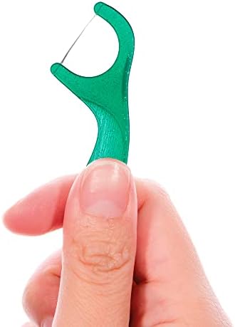 Detailed view of the fine tipped toothpick end on a GUM professional clean flosser.