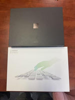 Microsoft Surface Pro 11 premium retail packaging including the 2-in-1 laptop and Inateck accessory bundle