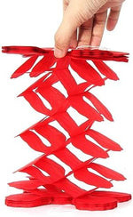 Vibrant rainbow theme birthday party decorations with twelve pieces of paper streamers.
