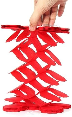 Vibrant rainbow theme birthday party decorations with twelve pieces of paper streamers.