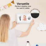 Finished personalized baby gift frame resting on a nursery shelf as a complete home decor item