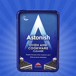 Astonish non toxic cleaning paste removing burnt grease from an oven enamel surface.