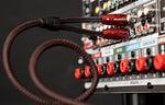 Side view highlighting the flexible double-balanced asymmetrical geometry design of the AudioQuest Golden Gate phono interconnect line.