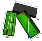 Top down view of mini golf putting game and pens