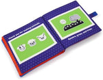 Urban Kiddy personalized baby book holding family photos.