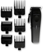 TPOB Mini Play professional barber clipper being held to demonstrate the ergonomic compact design and grip.