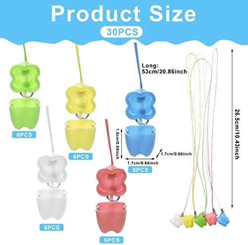 Close up of colorful tooth-shaped containers for kids