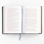 Open view of Jane Eyre book highlighting decorative color end pages.