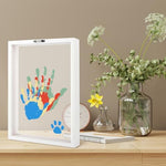 DIY family handprint art kit including acrylic glass plate, brushes, and six non-toxic paint colors.