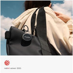 Modern pocket locator device attached securely to a set of house keys demonstrating everyday practical utility.