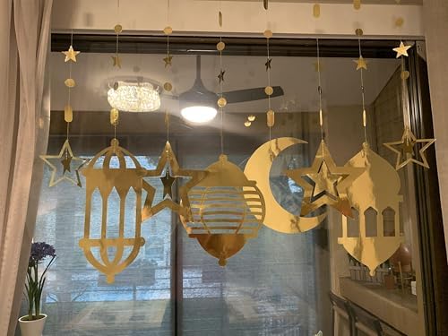 Creative ceiling display of the reusable Ramadan Mubarak decorations catching ambient light in a dining space.