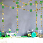 Four strands of Cheerland fifty two feet shamrock streamers hanging vertically from a classroom ceiling