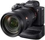 Sony VG-C4EM battery grip housing compartment open with dual battery tray visible.