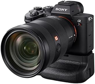 Sony VG-C4EM battery grip housing compartment open with dual battery tray visible.