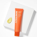 Aprilskin carrot seed oil blemish clearing cream texture close up.