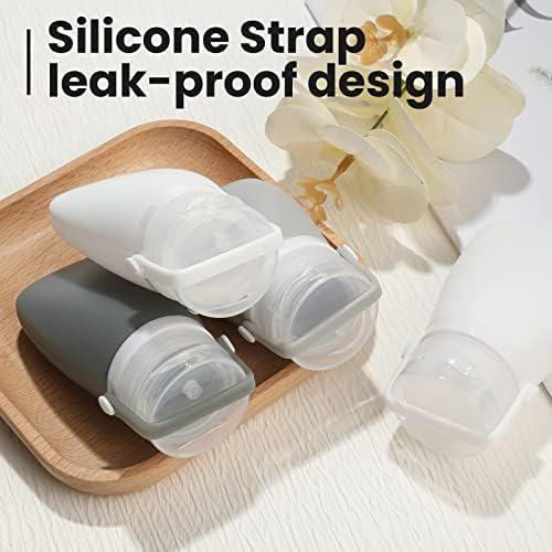 Two ounce white and grey squeezable silicone containers for toiletries