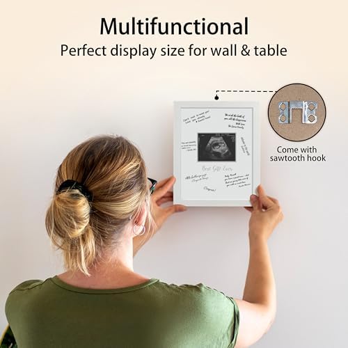 HAMUIERS white sonogram frame styled as elegant nursery wall decor above a baby crib.