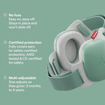 Baby wearing green Alpine Muffy earmuffs for noise protection