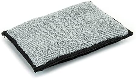 Autofiber Scrub Ninja detailing sponge being used to deep clean textured leather and vinyl automotive surfaces safely.