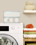 Durable high clarity acrylic storage container holding miscellaneous household essentials