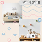 Eurset farmhouse style baby sonogram frame hanging on a wall via included string