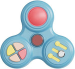 Close-up view of the mechanical clicking buttons and rolling spinners on the anxiety toy
