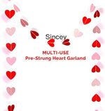 Close up view of the pink rose gold burgundy and red metallic hearts on the Valentine banner string