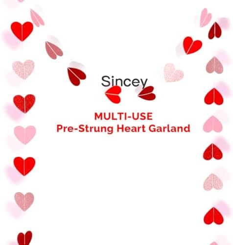 Close up view of the pink rose gold burgundy and red metallic hearts on the Valentine banner string