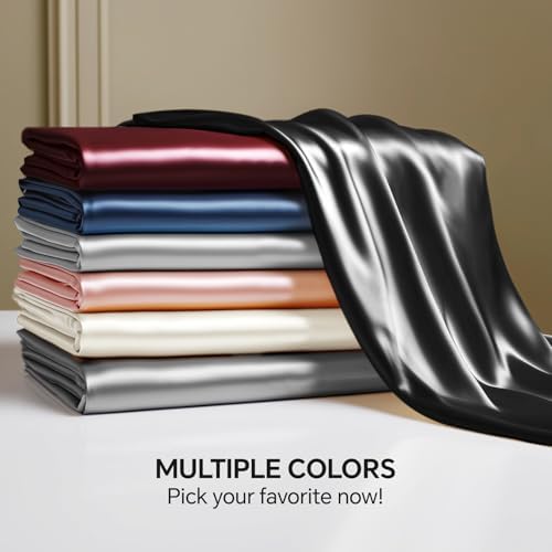 Bedroom setting featuring Bedelite black satin bedding