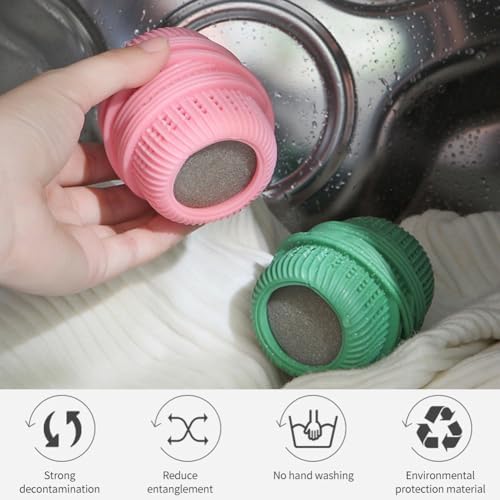 Soft lint removing dryer balls sitting on freshly laundered clean clothes