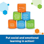 Blue social skills prompts on educational dice designed for peer problem solving and empathy building.