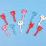 Cute cartoon animal fruit toothpicks arranged inside a toddler lunch box